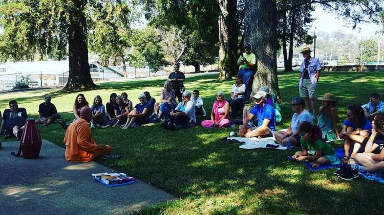 Speaking to a group in a park